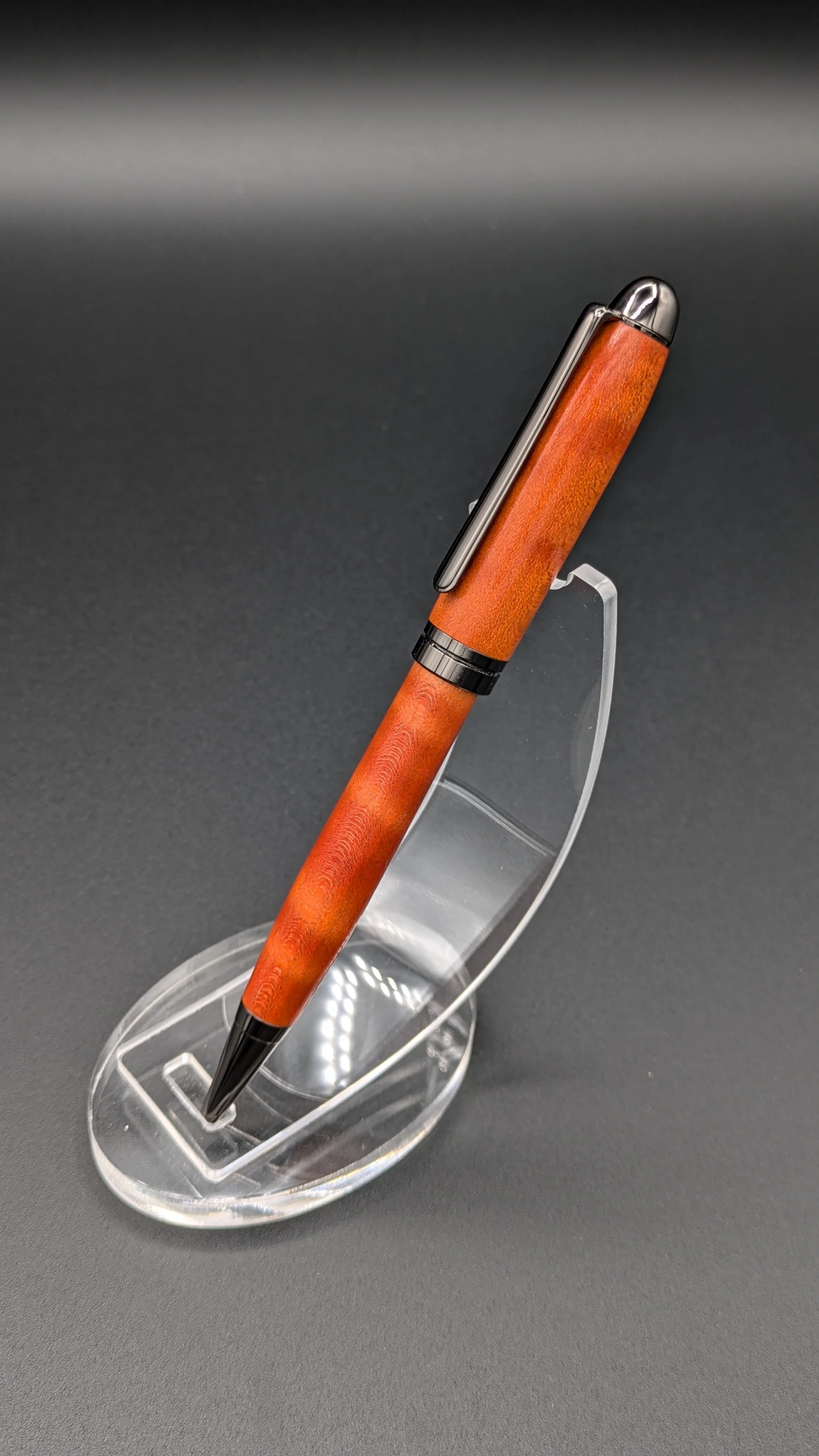 Euro made from Orange Dyed Curly Maple