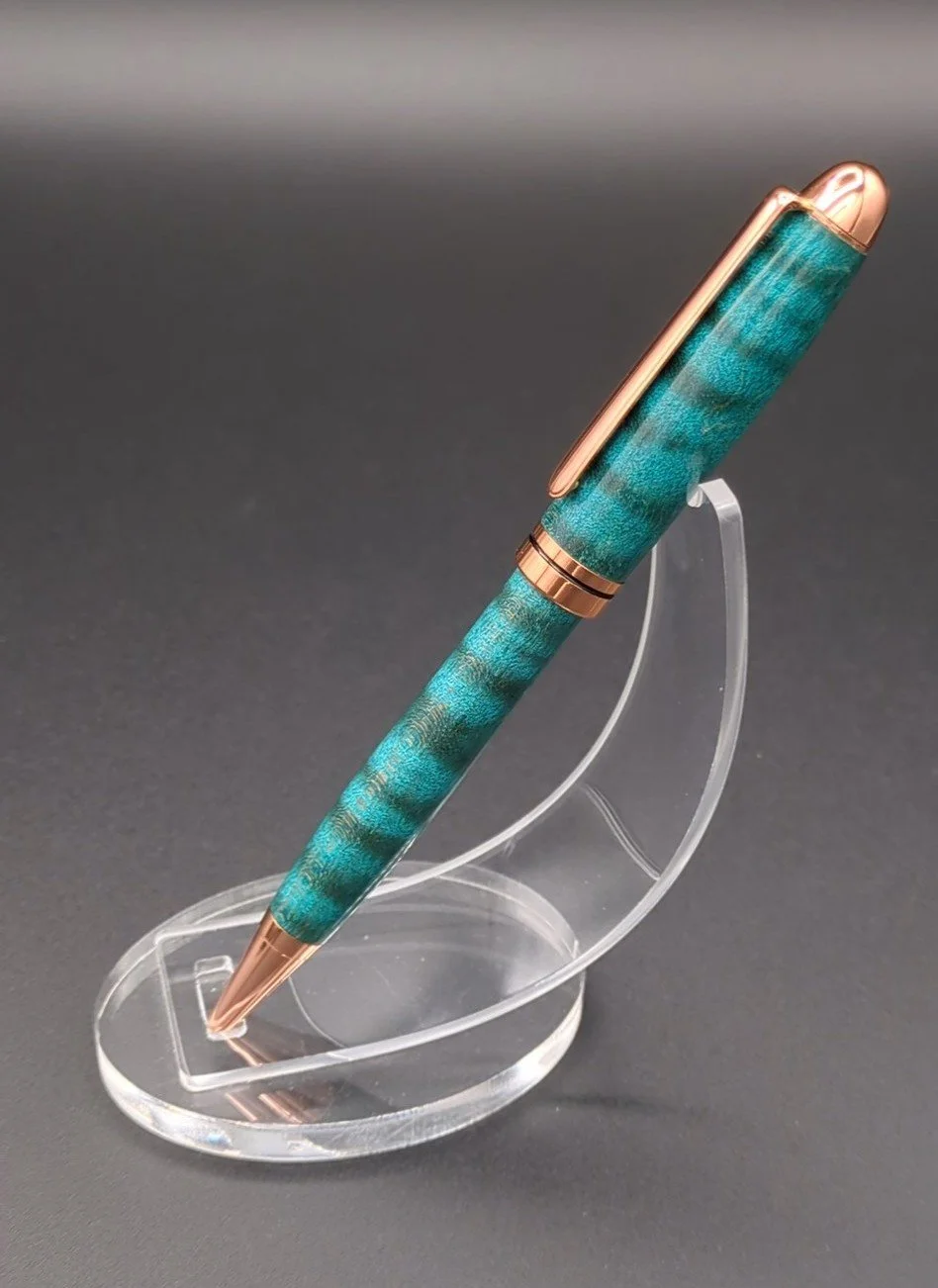 Euro made from Turquoise Dyed Curly Maple