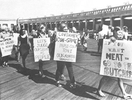 Photo of women picketing the Atlantic City boardwalk at the 1968 Miss America protest