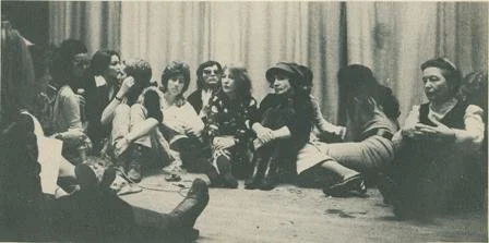 Photo of Simone de Beauvoir sitting with militants of the Mouvement de Liberation des Femmes