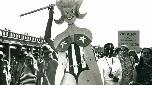 Photo of giant Miss America puppet and protestors at the Miss America protest 1968