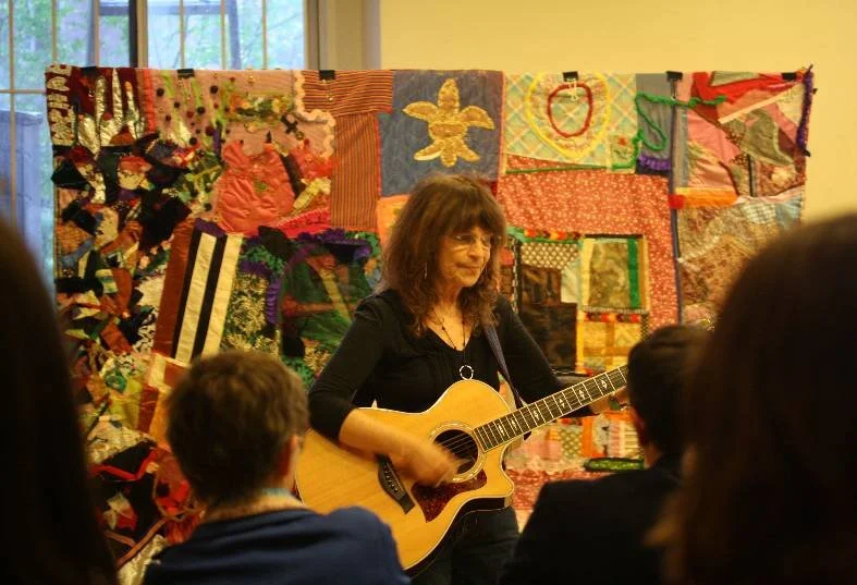 Iage of Bev Grant preforming at memorial