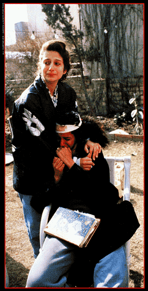 Photo of two women crying