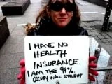 Photo of a woman holding a sign that reads "I have no health insurance. I am the 99%. Occupy Wall Street"