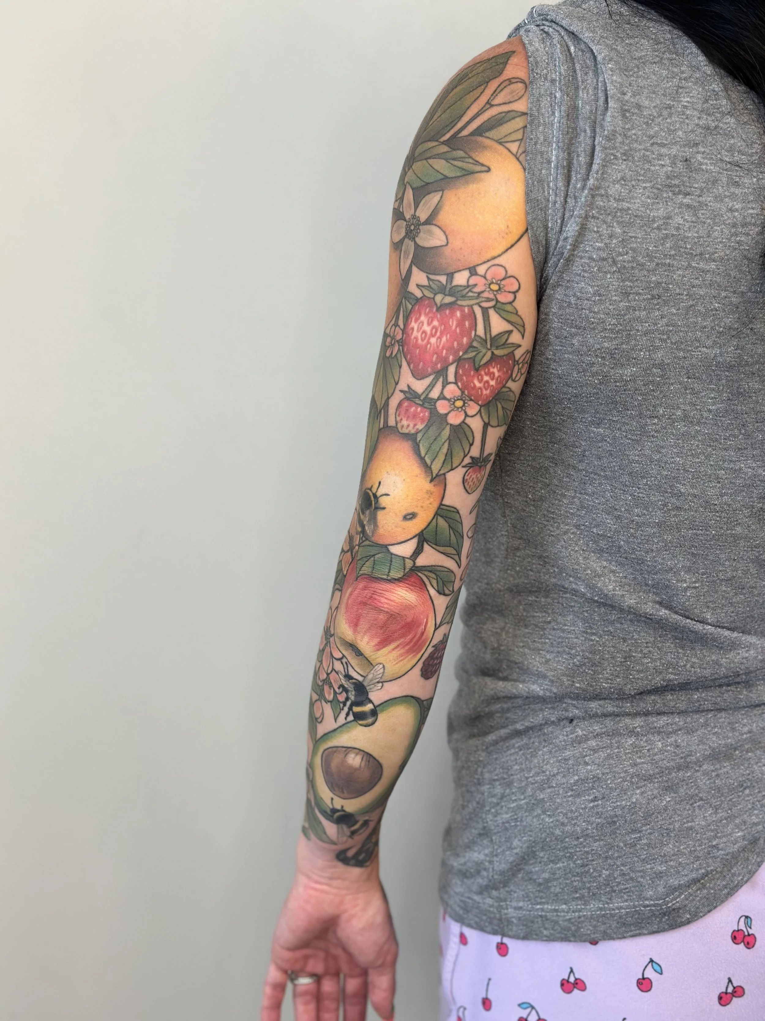 Fruit Sleeve. Pieces on inner forearm are reworks of pieces by another artist. Fully healed and settled.