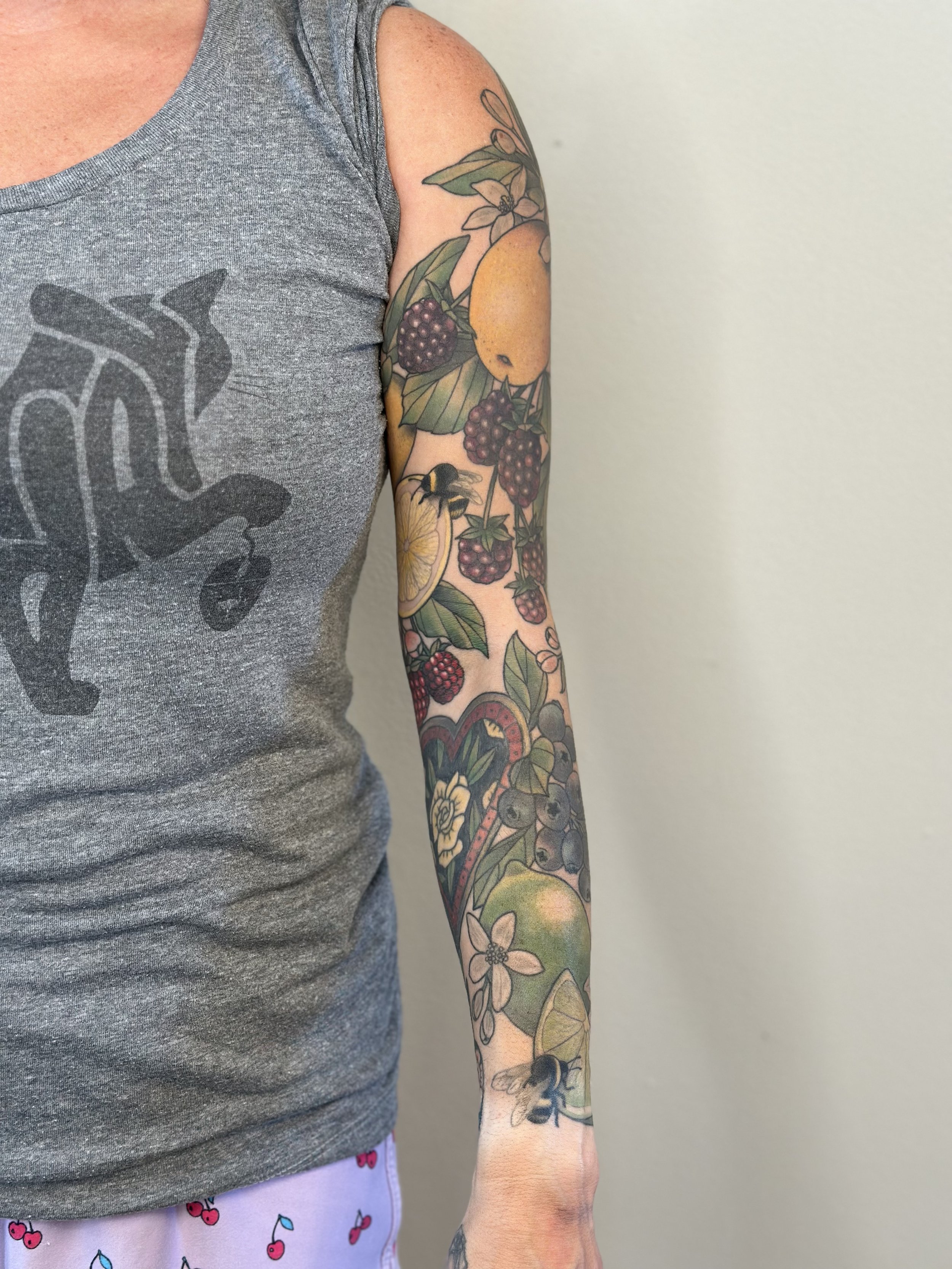 Fruit Sleeve. Pieces on inner forearm are reworks of pieces by another artist. Fully healed and settled.