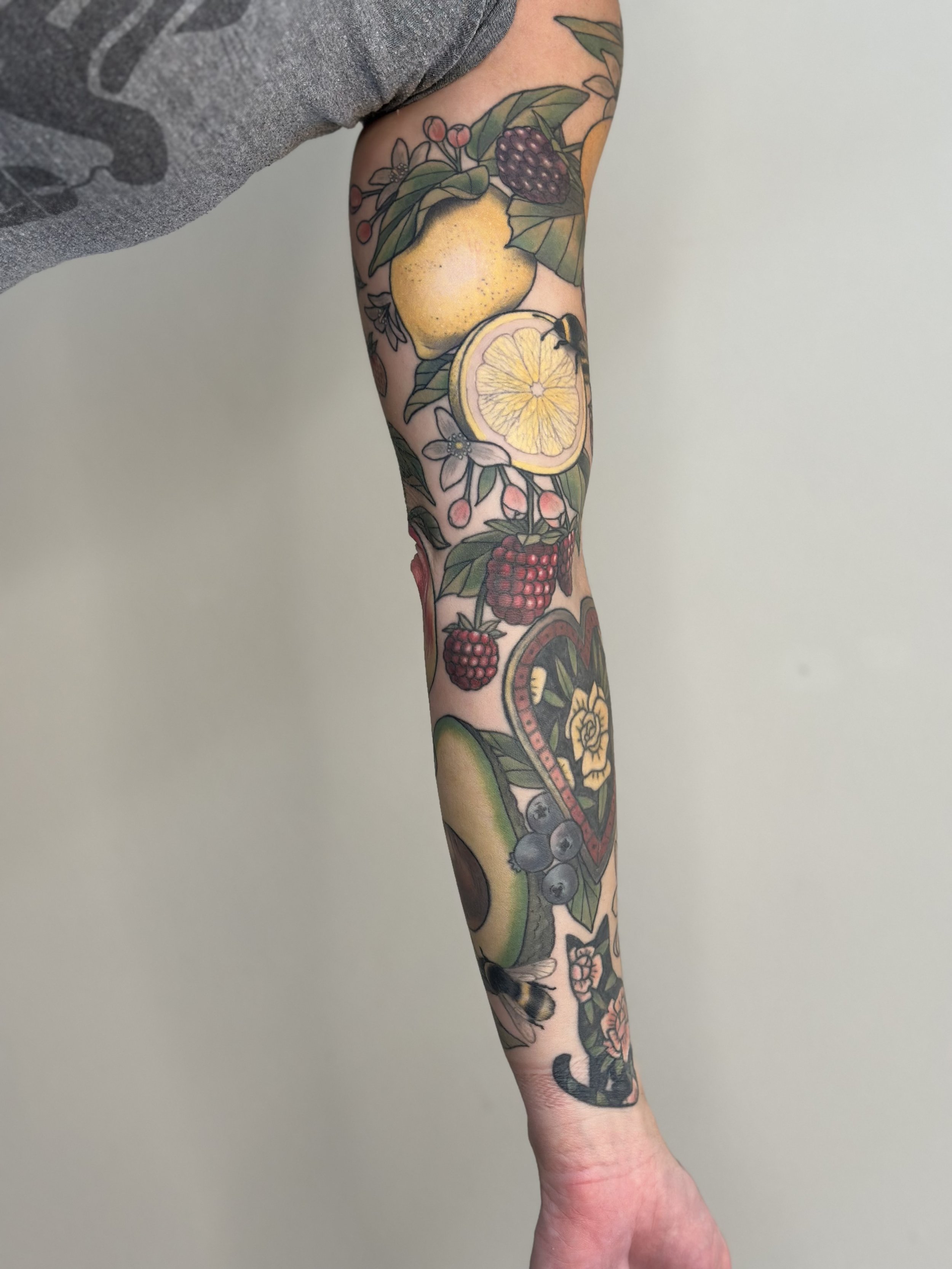 Fruit Sleeve. Pieces on inner forearm are reworks of pieces by another artist. Fully healed and settled.