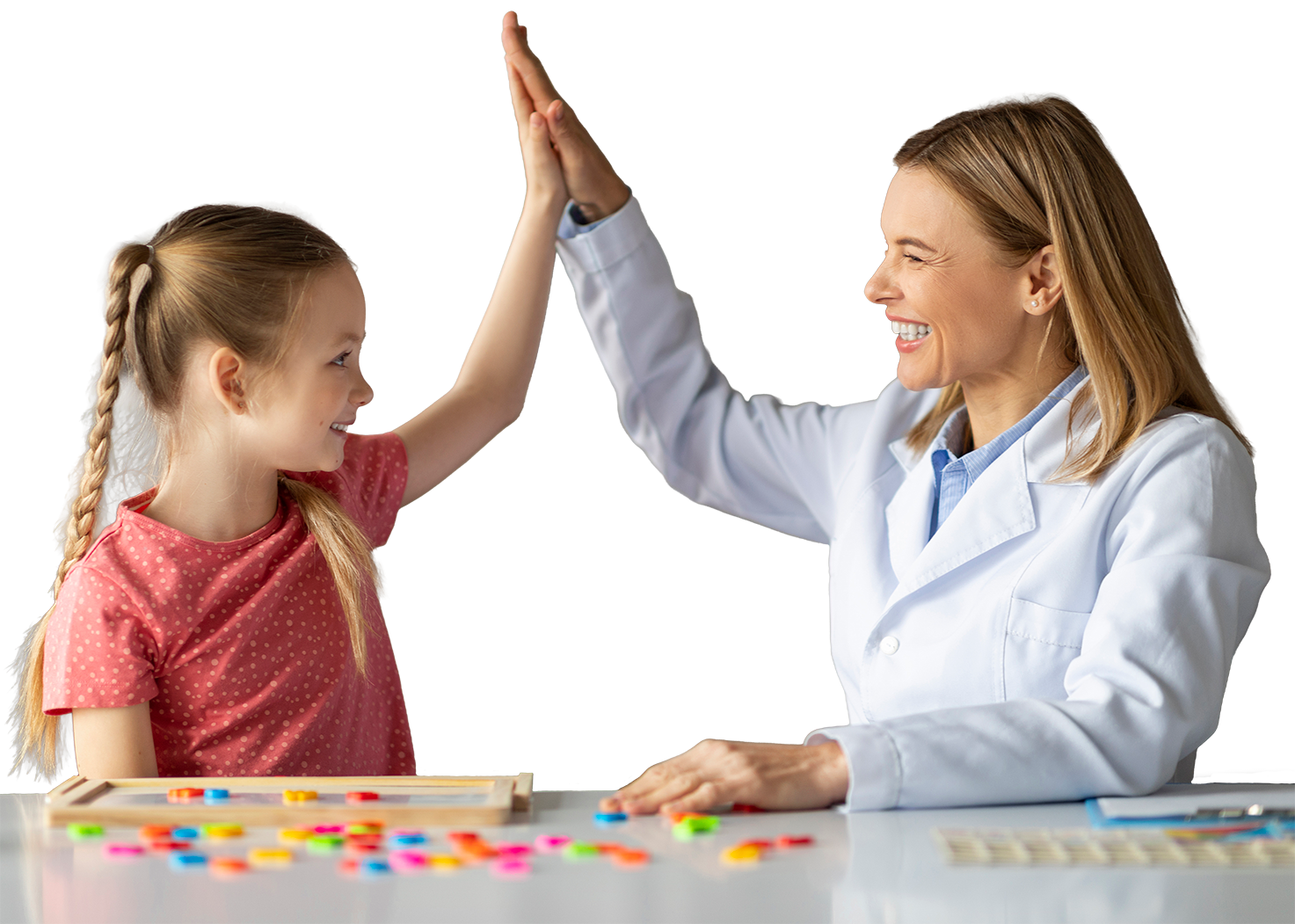 A female healthcare professional and a young girl giving each other a high five in a bright, organized office or clinic setting.