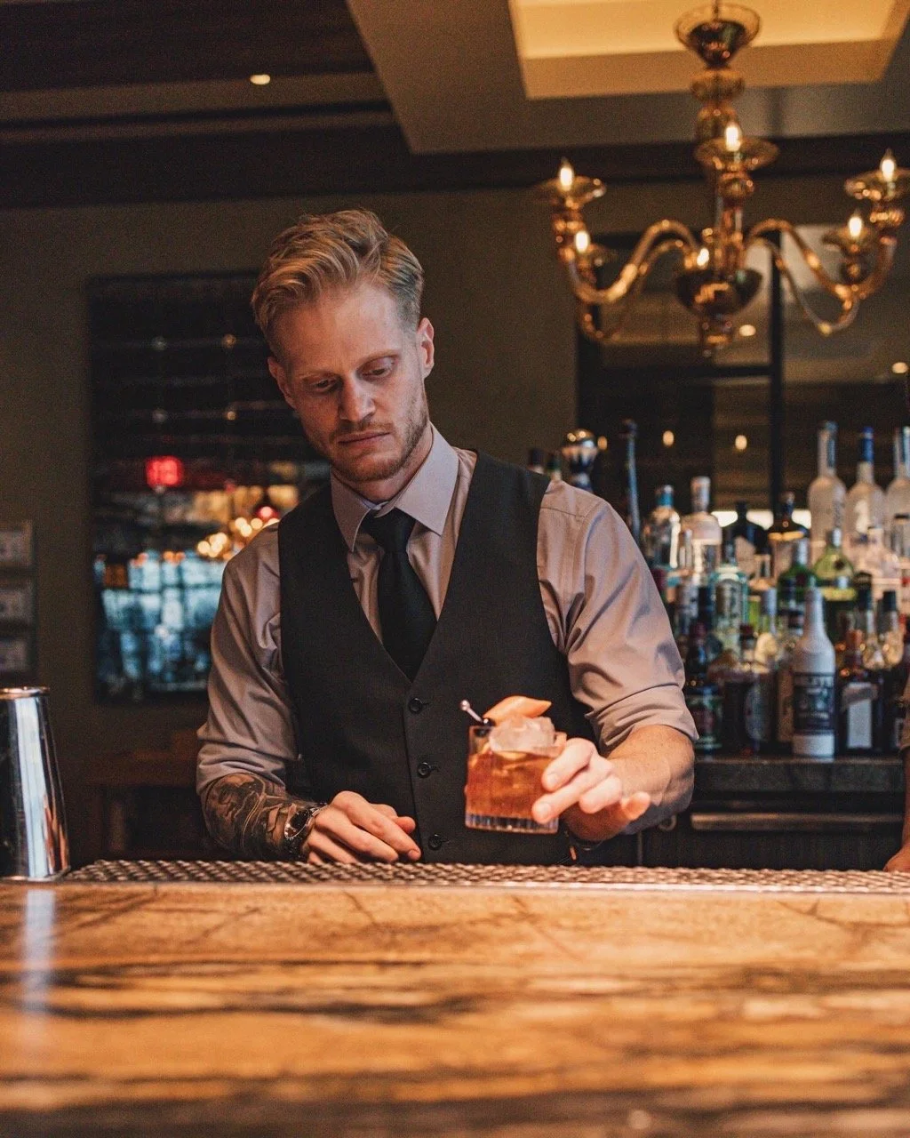 cocktail influencer @notjustabartender making a drink
