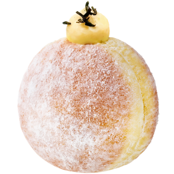 Earl Grey donut dusted with powdered sugar and filled with Earl Grey cream, topped with loose tea leaves