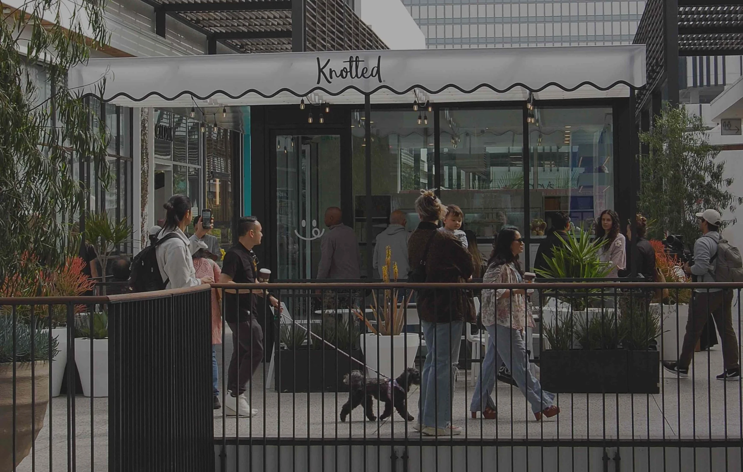 Cafe Knotted at Westfield Century City in Los Angeles, with customers walking by the storefront and outdoor seating area