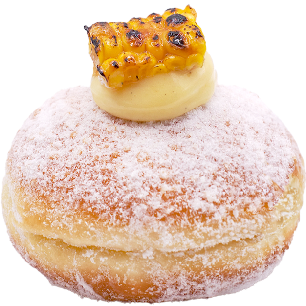 Roasted Sweet Corn donut dusted with powdered sugar and filled with sweet corn cream, topped with a roasted corn kernel piece