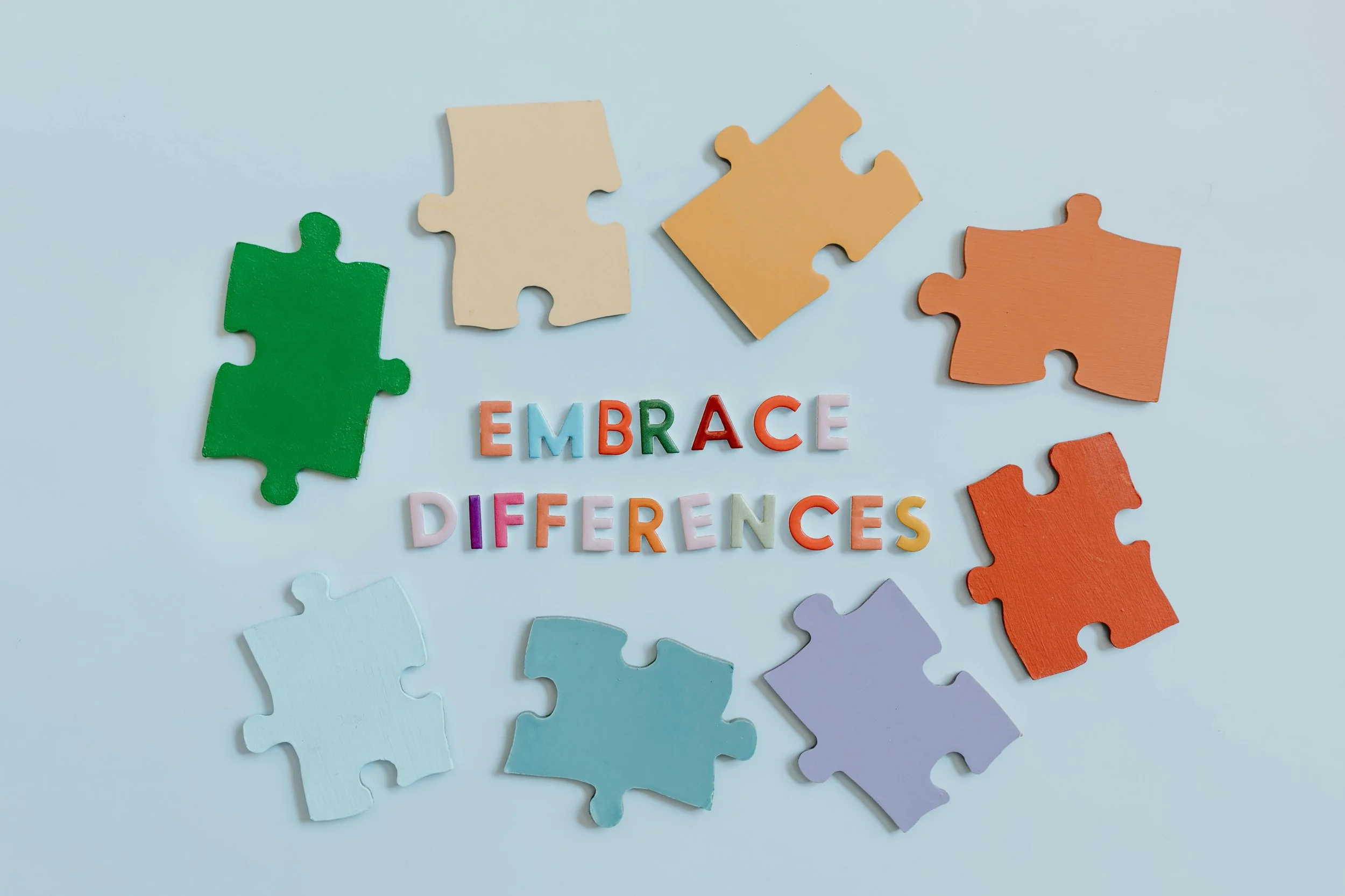 Colorful puzzle pieces with the phrase 'Embrace Differences,' showcasing autism and ADHD, ADD assessments for individuals of all ages at MindView Psychology