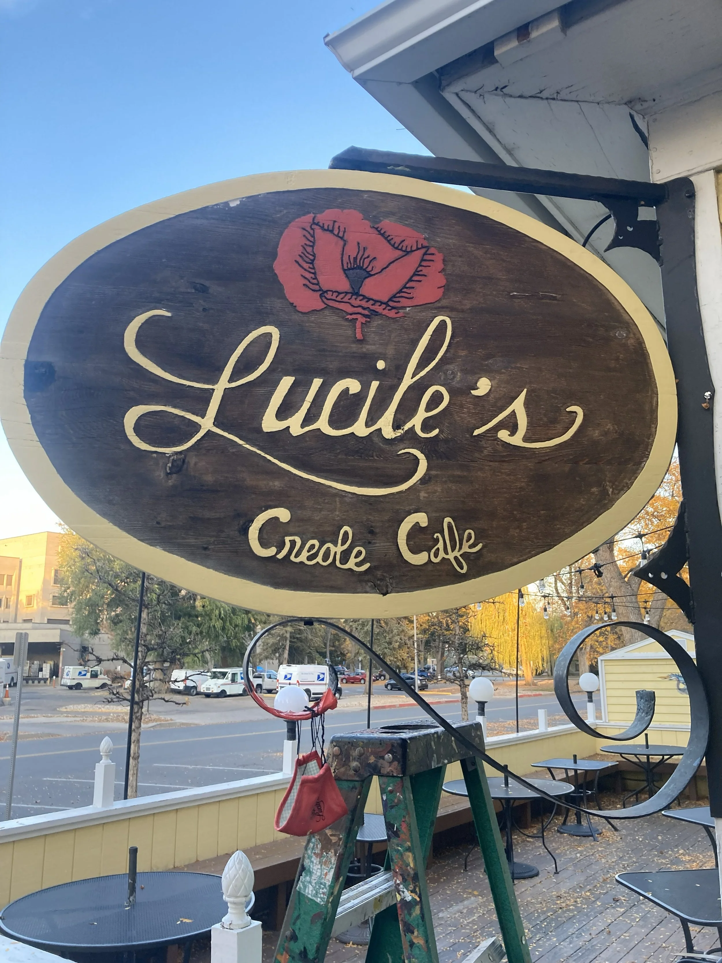 Lucile's sign, 2023, exterior acrylic paint on wood, located in Old Town Fort Collins