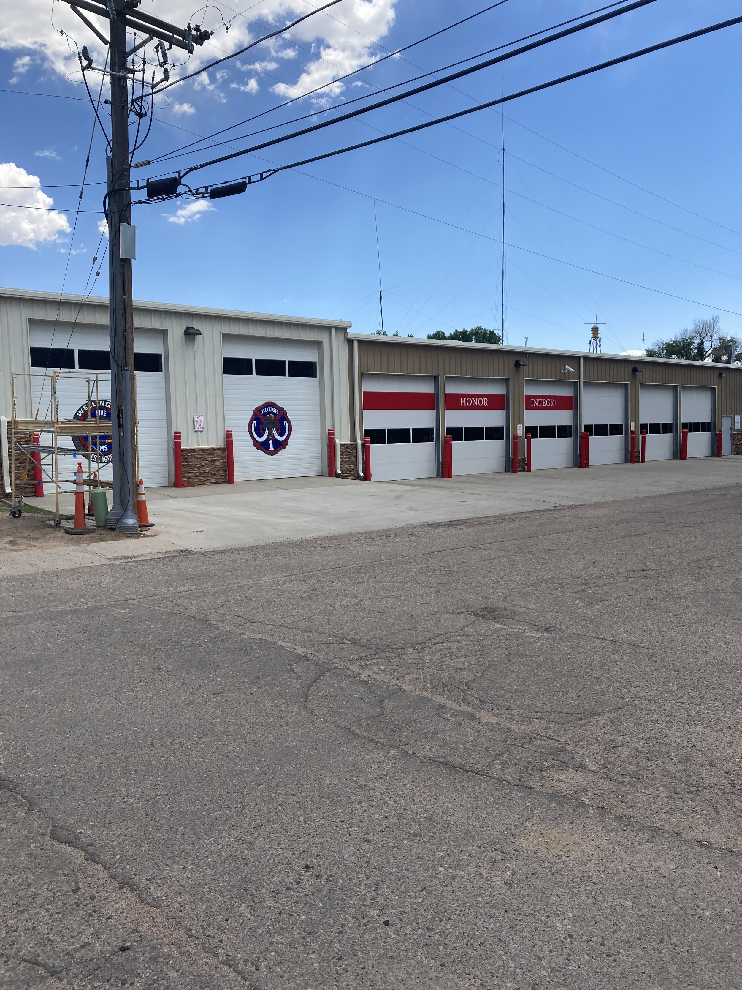 Wellington Fire Department, 2025, exterior acrylic paint on corrugated metal, 12' x 12' doors, commissioned by the City of Wellington