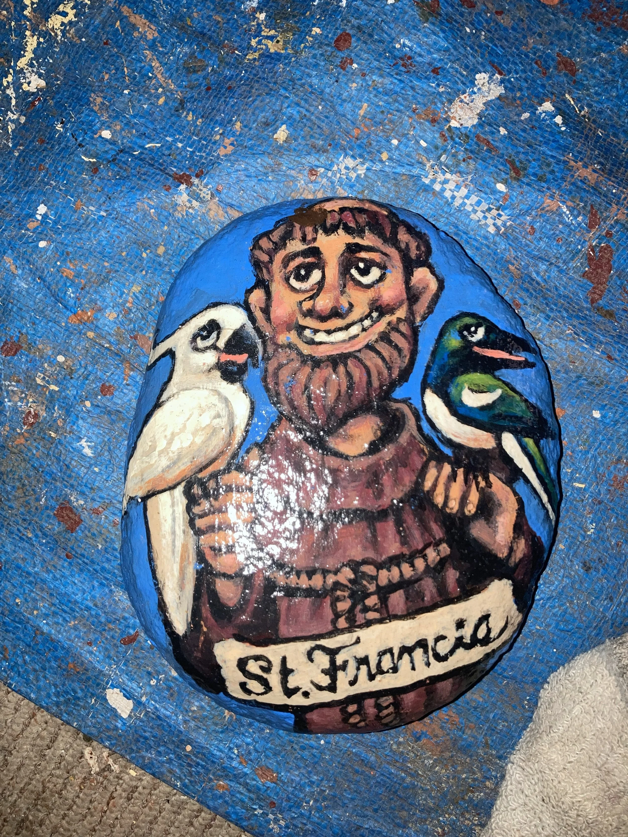 St. Francis, 2026, exterior paint on found and polished rock, private collection 