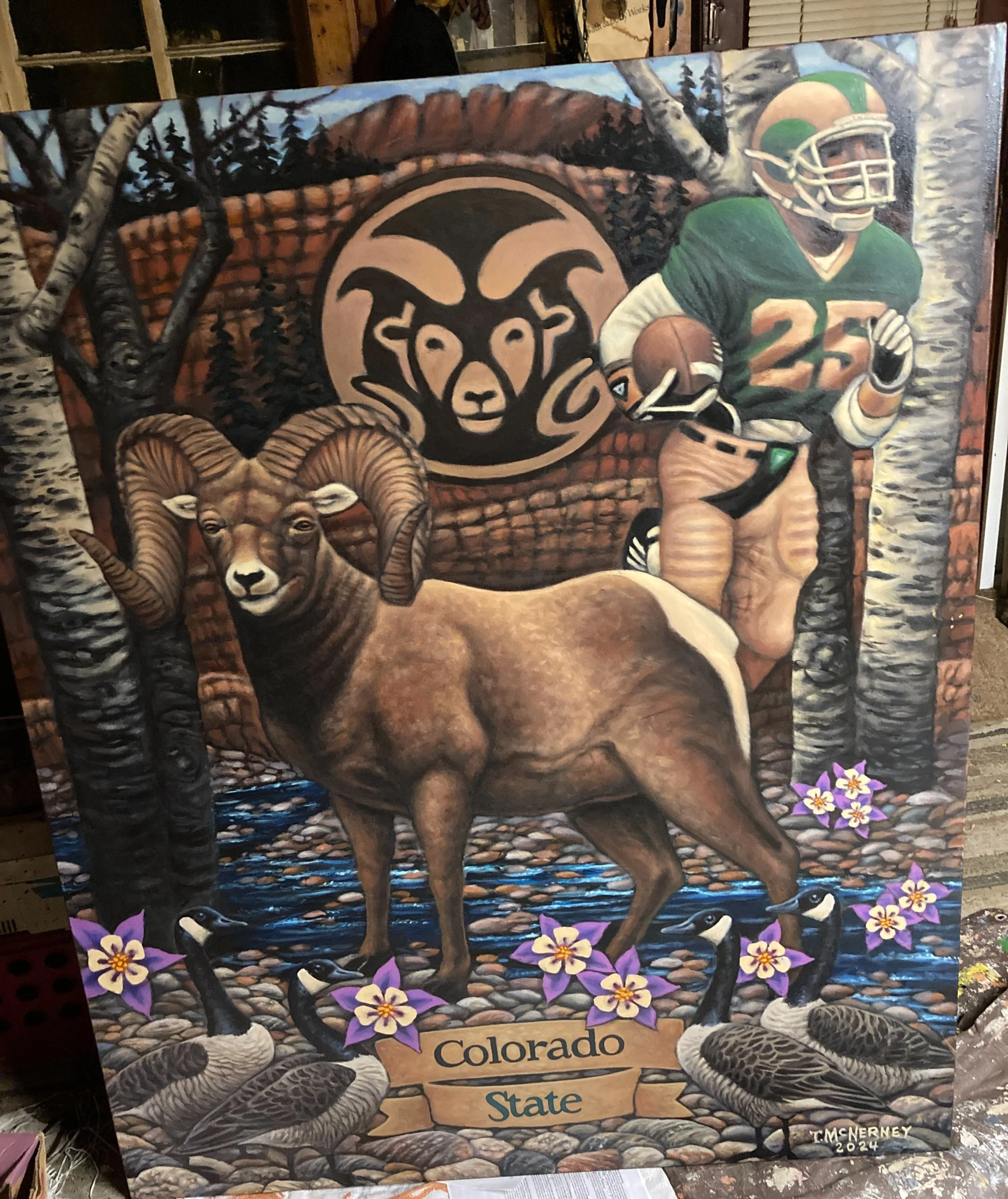 A mural depicting Colorado State almater, a football player wearing a green jersey with the number 25, and a ram logo in the background. The scene includes pine trees, wildflowers, and water, with the text 'Colorado State' at the bottom.
