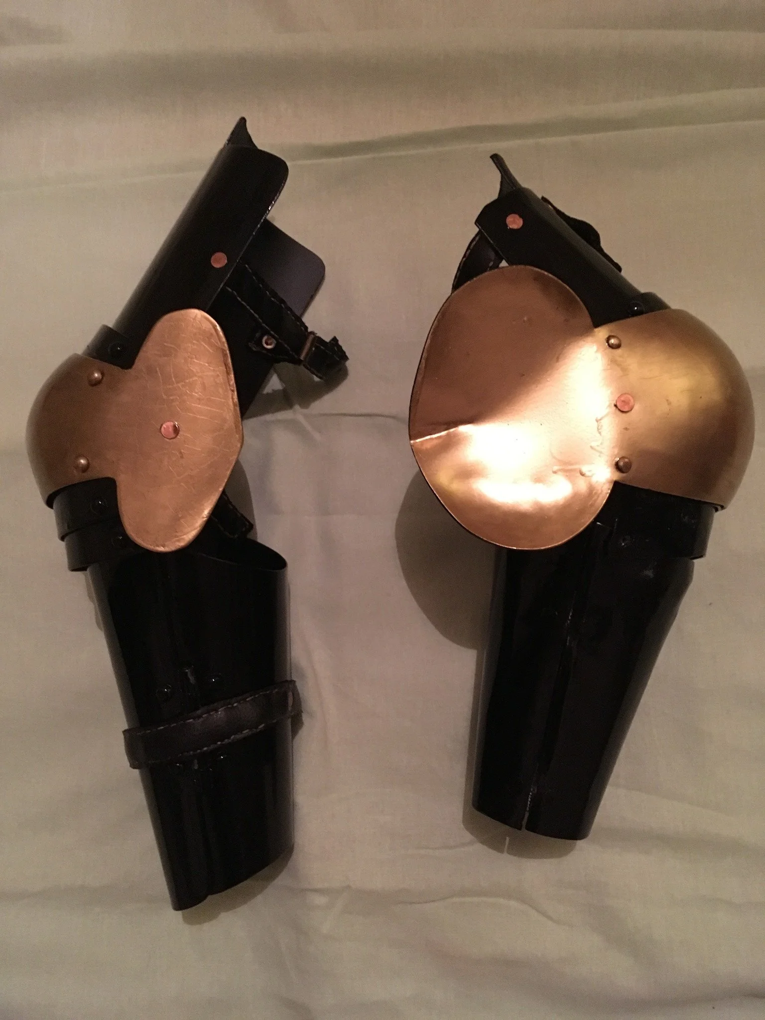 Steel arm armor - de-rusted, painted black and gold, and new straps installed.