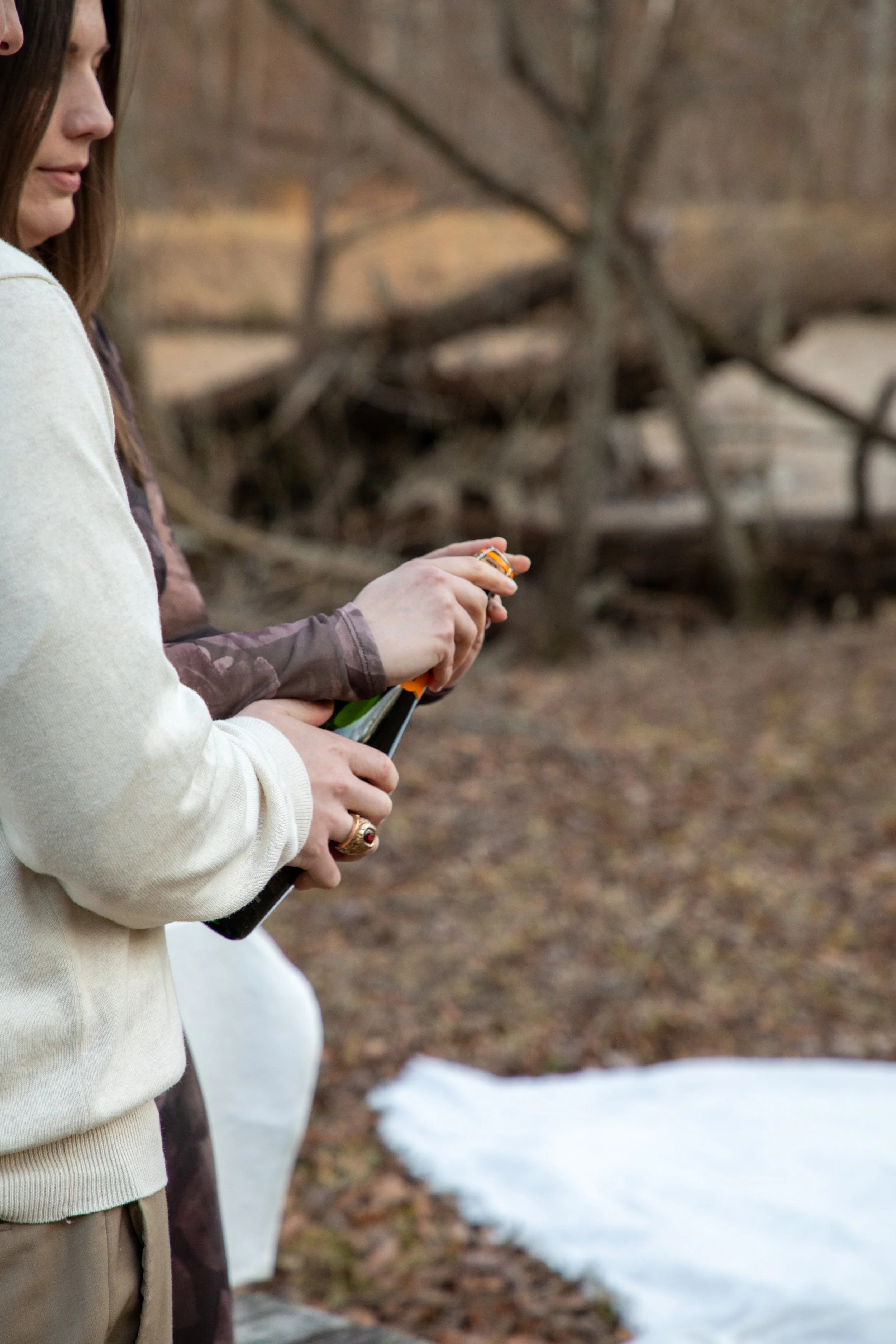 Engagement Photography by Will Locke near Richmond, VA in Montpelier. A newly engagement couple opens a bottle of Veuve Clicquot champagne.
