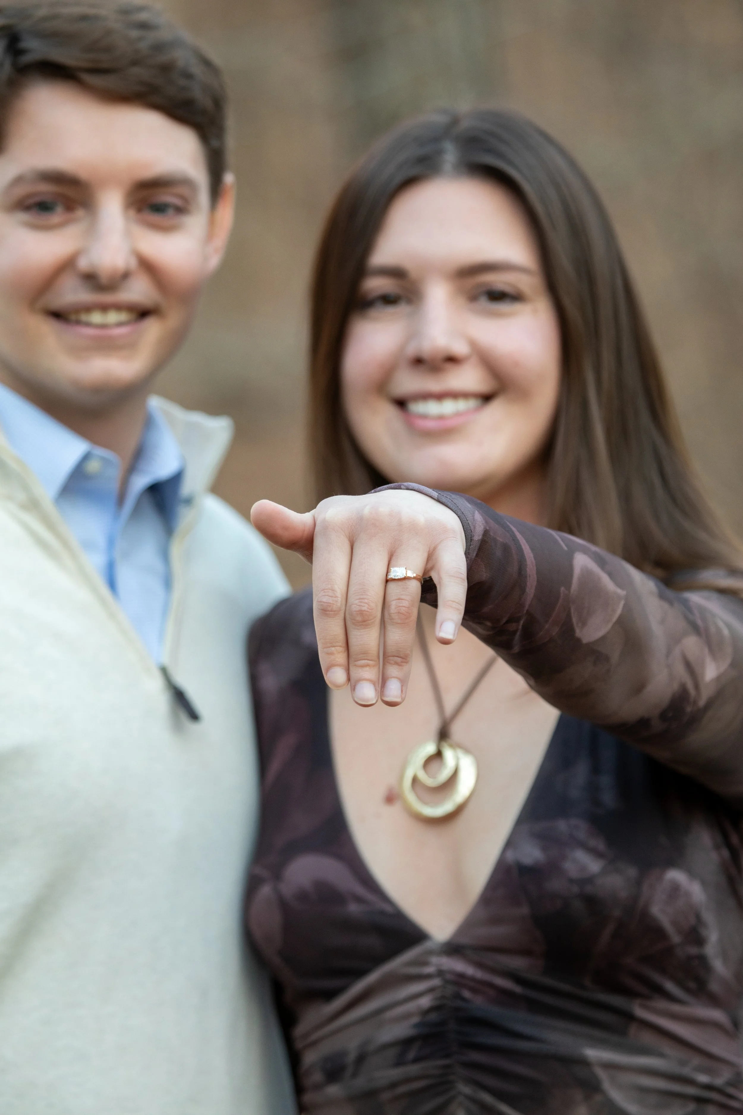 Engagement Photography by Will Locke near Richmond, VA in Montpelier. A newly engaged couple pose and show off a engagement ring.