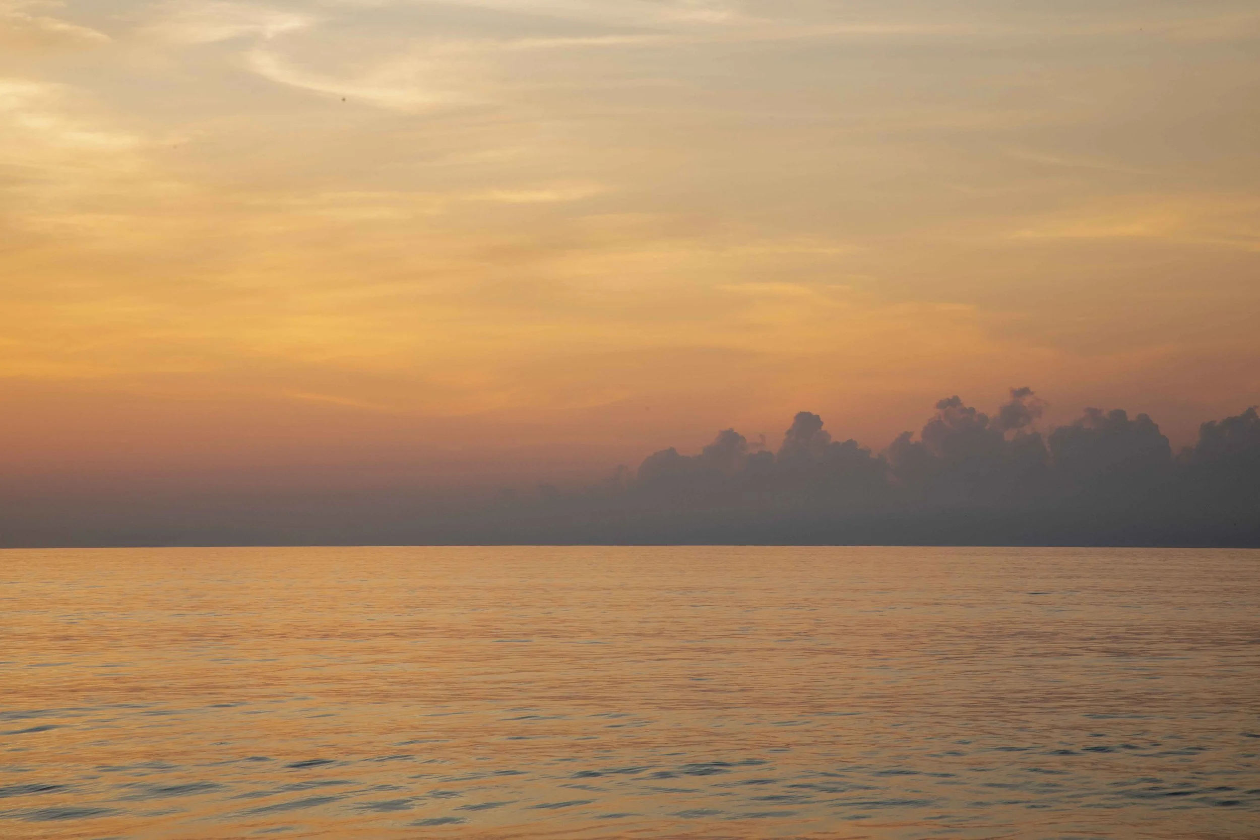 1:10 Golden Clouds on Ocean Horizon.jpg