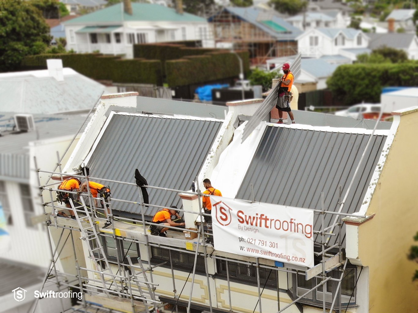 Drone view of Swift Roofing installers installing new Trimrib profile roofing from Roofing Industries.