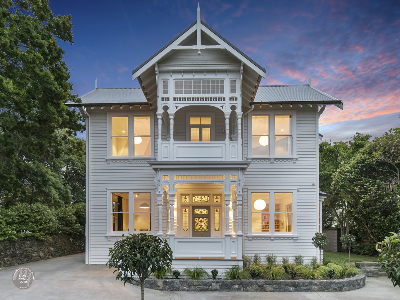 Front of house view at night of new Swift Roofing installed Corrugate Roof on Ninety45 House of the Year, Silver Award Winner of the Renovation Over $1M category, in Epsom - image c/o House of the Year