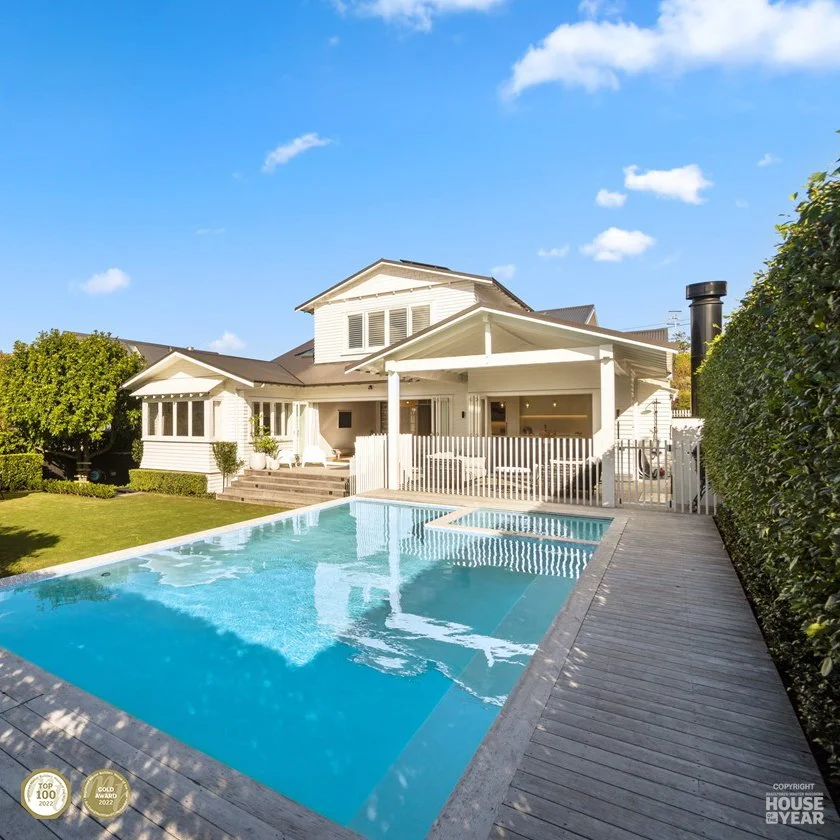 View across pool to backyard of Remuera project where Swift Roofing installed ColorCote ZinaCore coated, Ironsand coloured Corrugate roofs. Ninety45 won a National Top 100 Award, was the Regional Category Winner Auckland