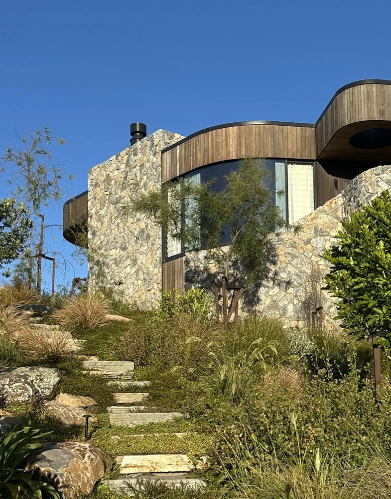 Curved parapet capping and window flashings around roof of Ti Point House, a Lindesay / Construction Crosson Architects / Rochford Landscapes project where Swift Roofing installed RT7 Roof in ColorCote Horoeka coloured MagnaFlow from Roofing Industri