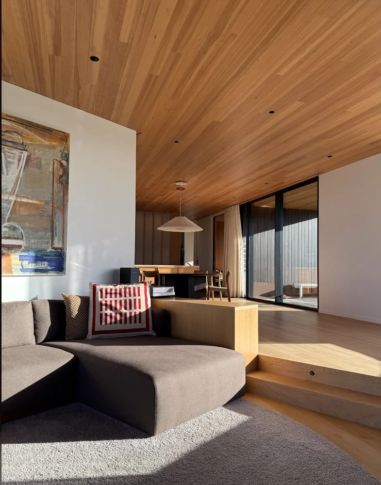 Living room at Ti Point House, a Lindesay / Construction Crosson Architects / Rochford Landscapes project where Swift Roofing installed RT7 Roof in ColorCote Horoeka coloured MagnaFlow from Roofing Industries. Photo Crosson Architects