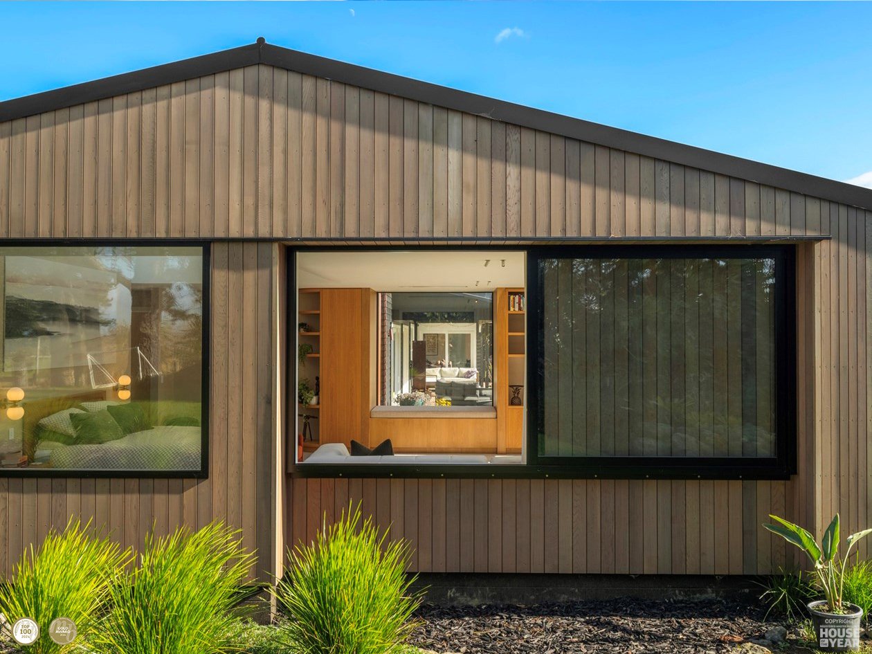 Side view straight on of House of the Year Regional Gold and National Top 100 Norwest Build Project where Swift Roofing installed New Addition Roof along with custom flashing work to the Bay Window - Image c/o House of the Year