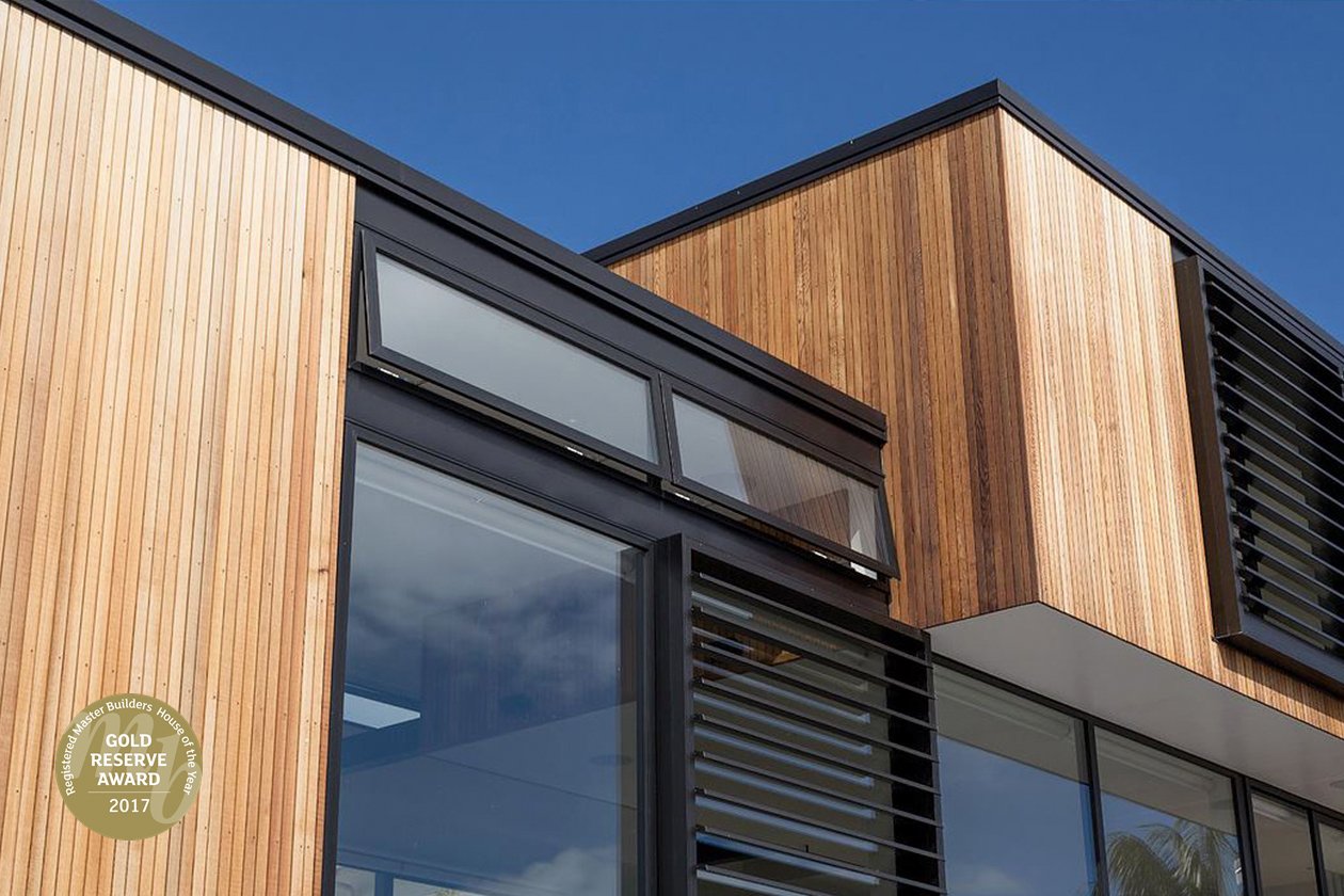 View of side of House of the Year Gold Reserve Winning Broswick Builders Renovation where Swift Roofing installed Corrugate & True Oak Roofs - Image c/o House of the Year