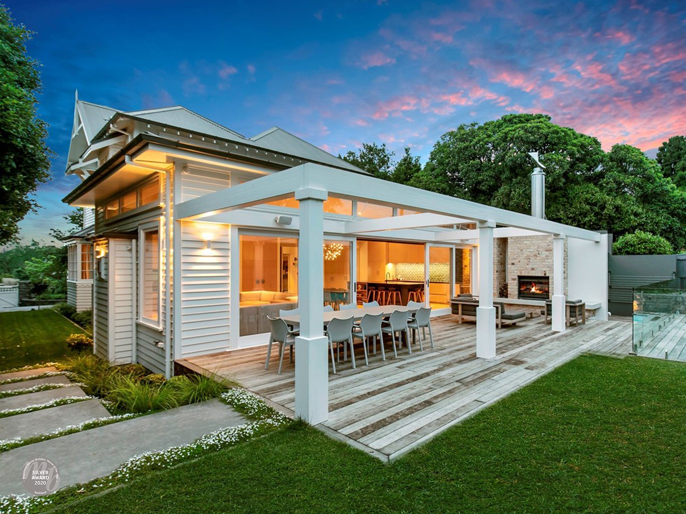 Rear back deck at night of new Swift Roofing installed Corrugate Roof on Ninety45 House of the Year, Silver Award Winner of the Renovation Over $1M category, in Epsom - image c/o House of the Year