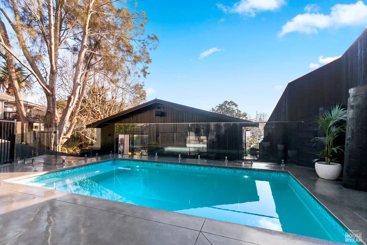 View of back deck and swimming pool on House of the Year Builders Own Home entry in Rothesay Bay where Swift Roofing installed Trimrib Profile Roof & Dimondclad Rib50 Wall Cladding - Image c/o House of the Year