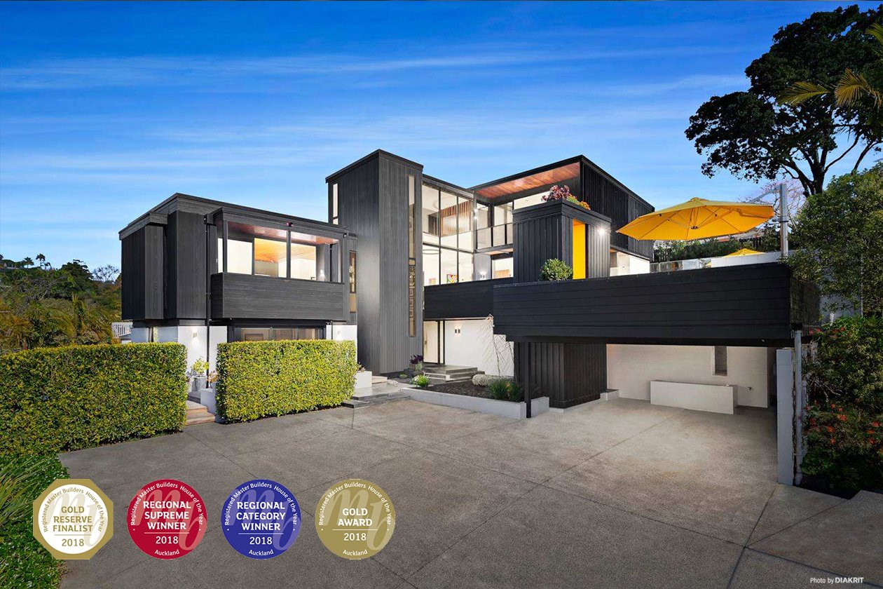 Pulled back view across driveway towards House of the Year Winning Hargraves Homes project where Swift Roofing installed a new Trimrib Roof - Image c/o House of the Year / Hargraves Homes