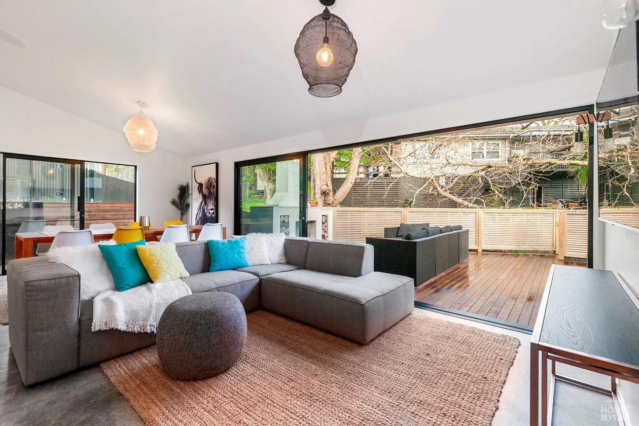 View of back deck into living area on House of the Year Builders Own Home entry in Rothesay Bay where Swift Roofing installed Trimrib Profile Roof & Dimondclad Rib50 Wall Cladding - Image c/o House of the Year