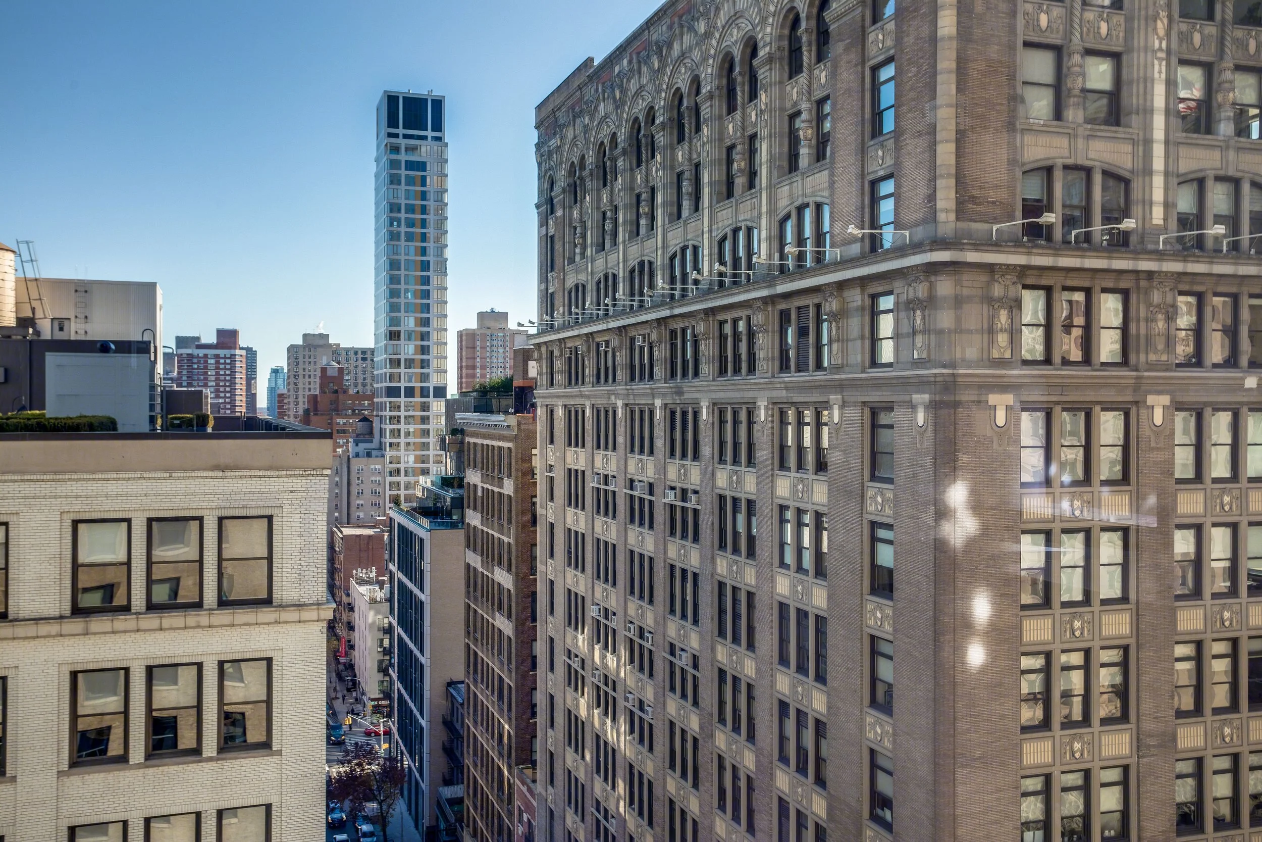 Cityscape view of tall buildings in a downtown area on a clear day.