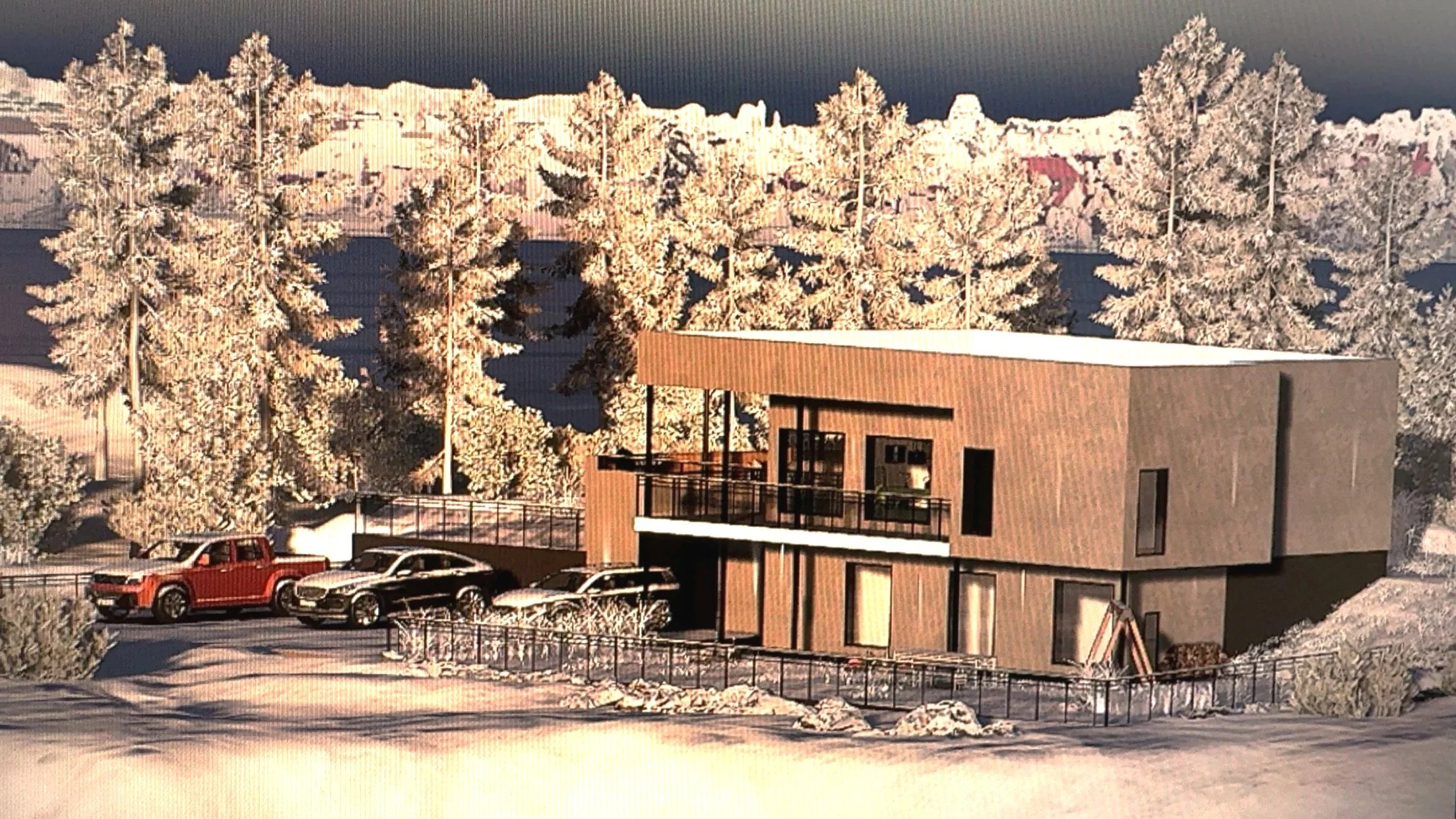 Snehygg hus under snøbelagte trær med flere parkerte biler foran, på vinterlandskap.