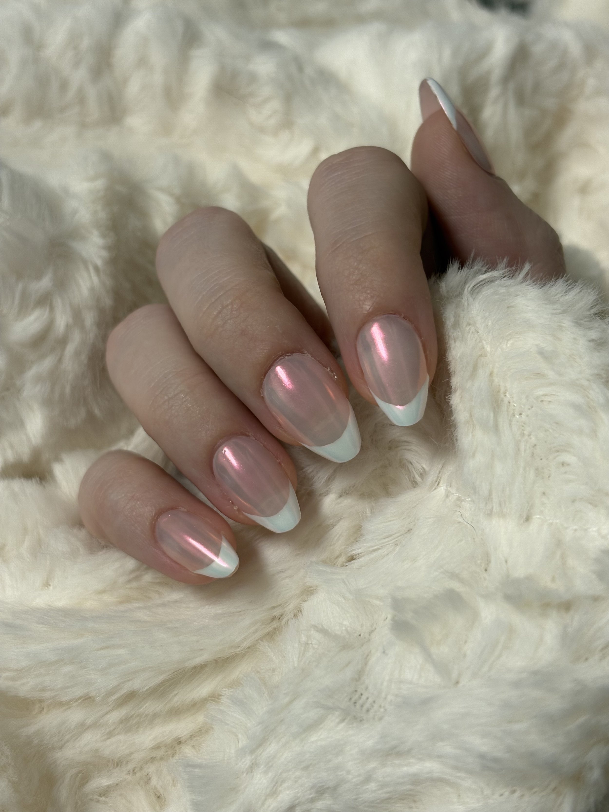 Set of classic french tip nails with pearl chrome overlay