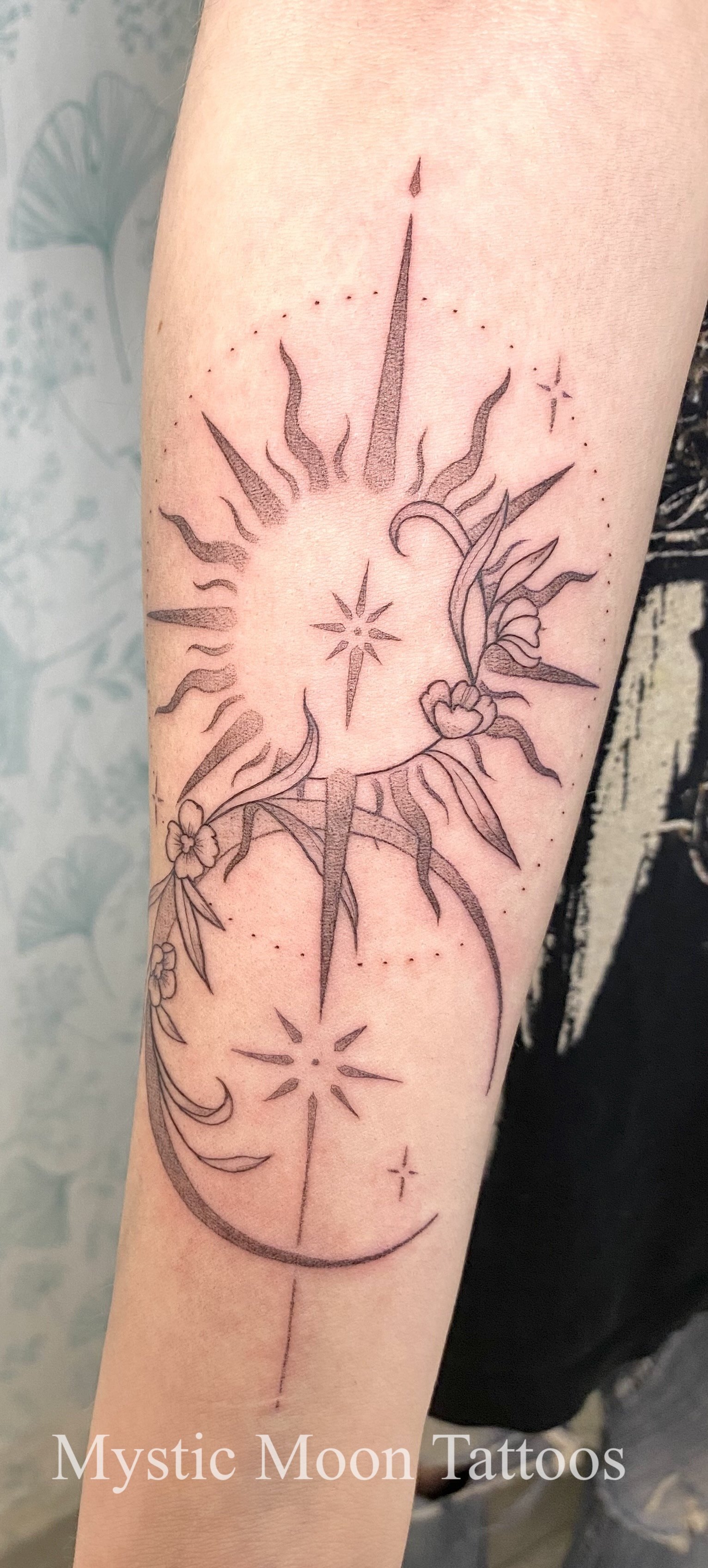 Sun, moon, and stars, delicately weaved together with vines. Organic, yet geometric.
