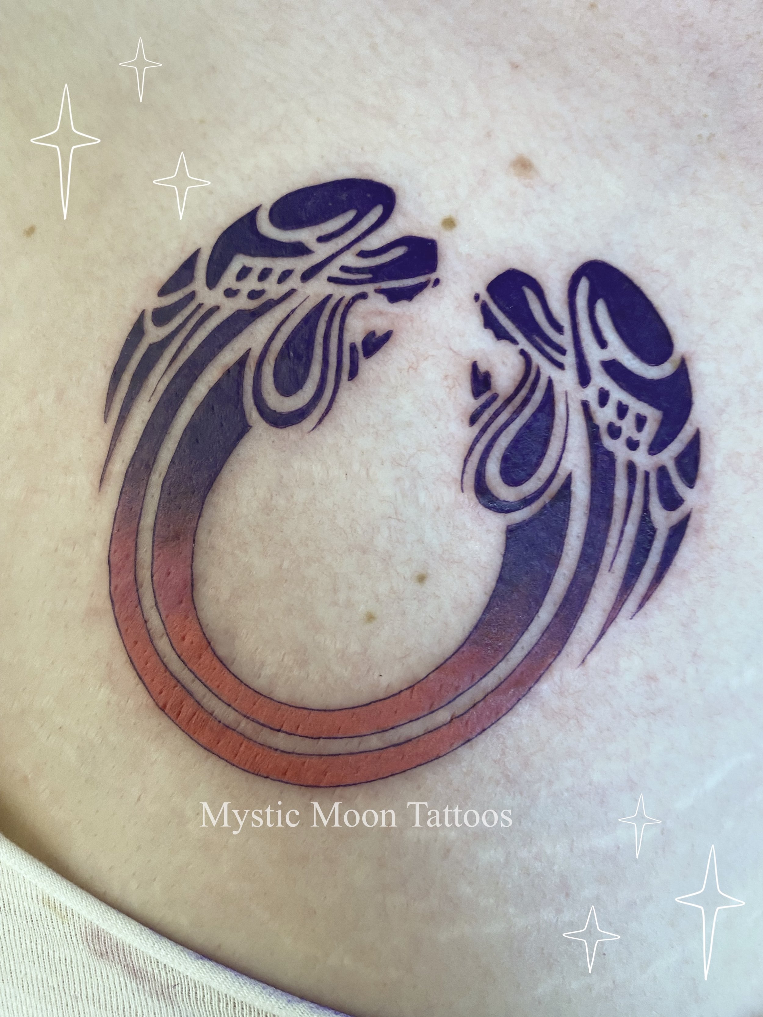 (Part 1)Tattoo from the musical "Jesus Christ Superstar"! We rocked out to the musical soundtrack while our lovely client got matching symbols on both sides of her chest! Matching with part 2.