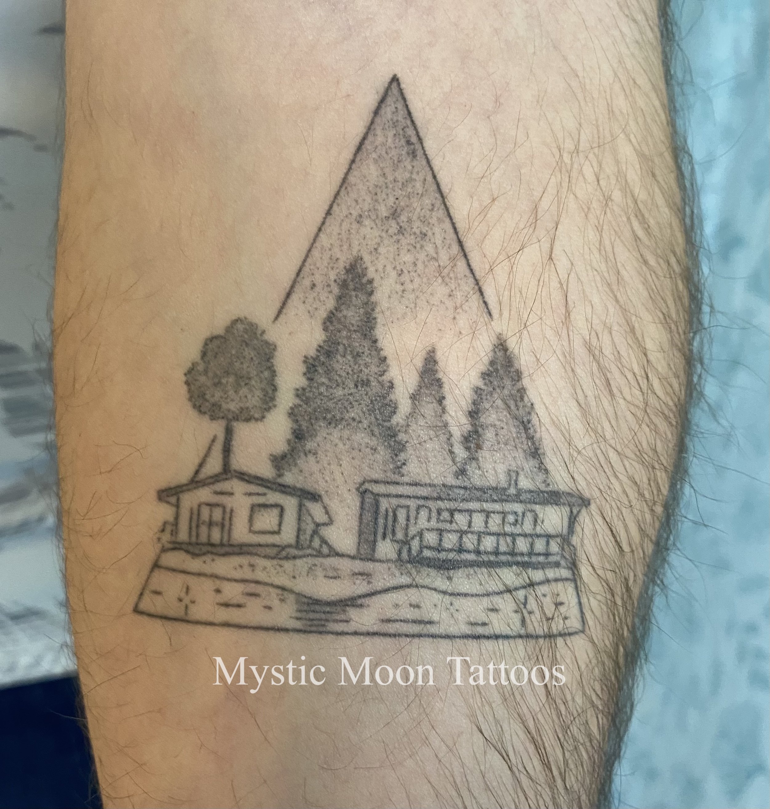 Family cabin tattoo, nicely healed!