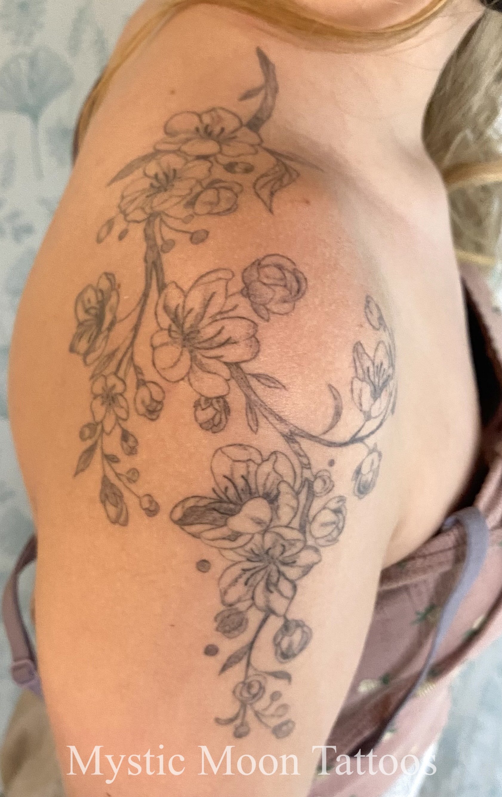 Delicate wrapping cherry blossom tattoo.