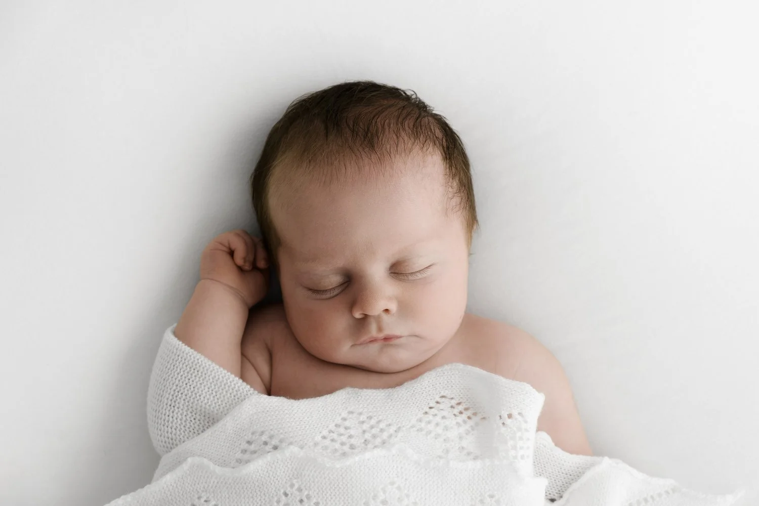 Why Newborn Photographers Struggle to Charge More, and What Actually Changes It