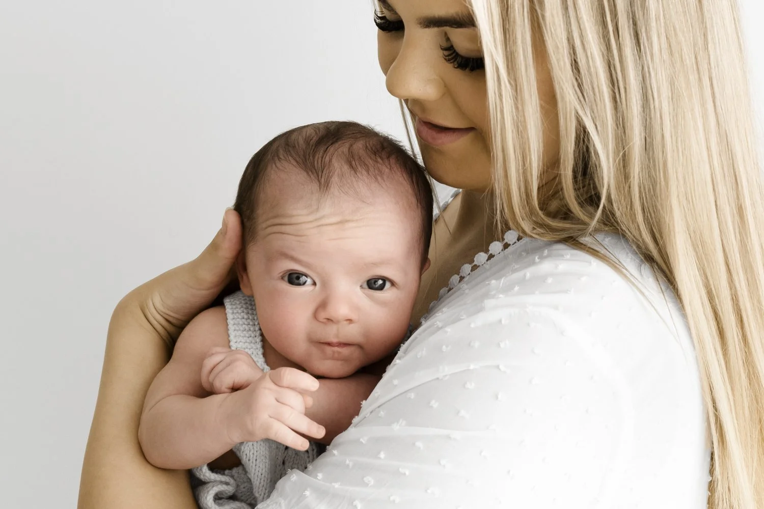 Awake newborn baby with parent at Mabel and Moose studio by Ally Stuart-Ross
