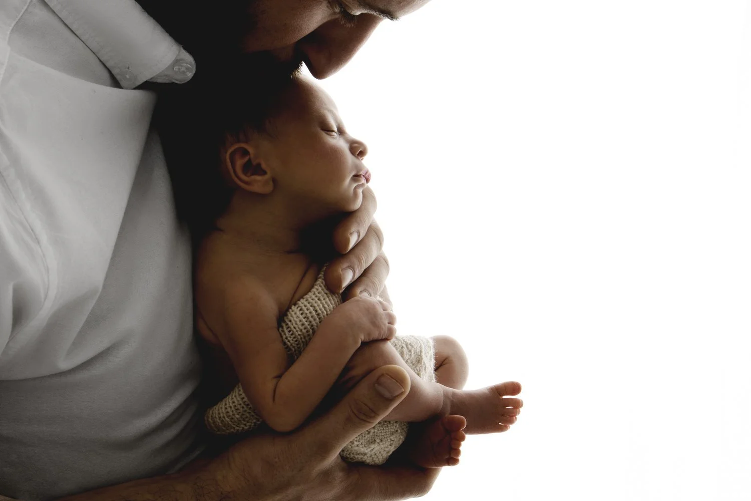 Dad holding newborn baby backlit portrait by Ally Stuart-Ross Mabel and Moose Education