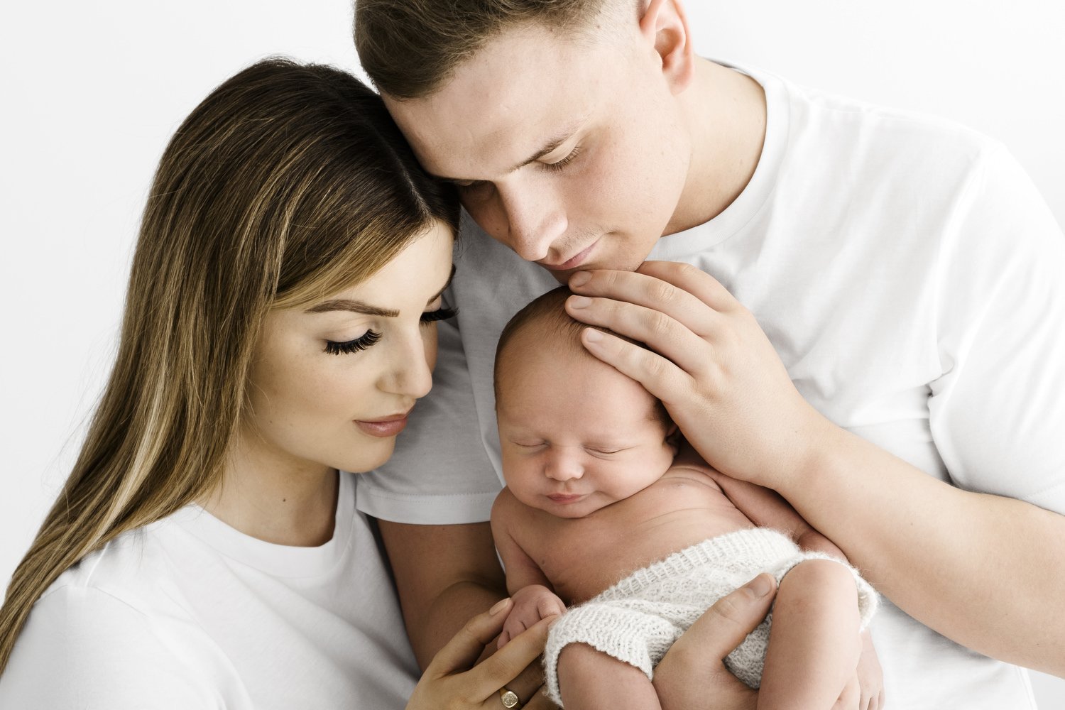 Parents gazing at newborn baby natural moment at Mabel and Moose studio by Ally Stuart-Ross