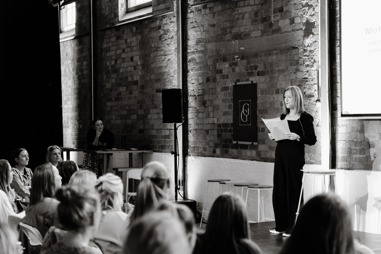 Ally Stuart-Ross speaking at the Gather to Grow newborn photography conference in Bristol about the business of newborn photography