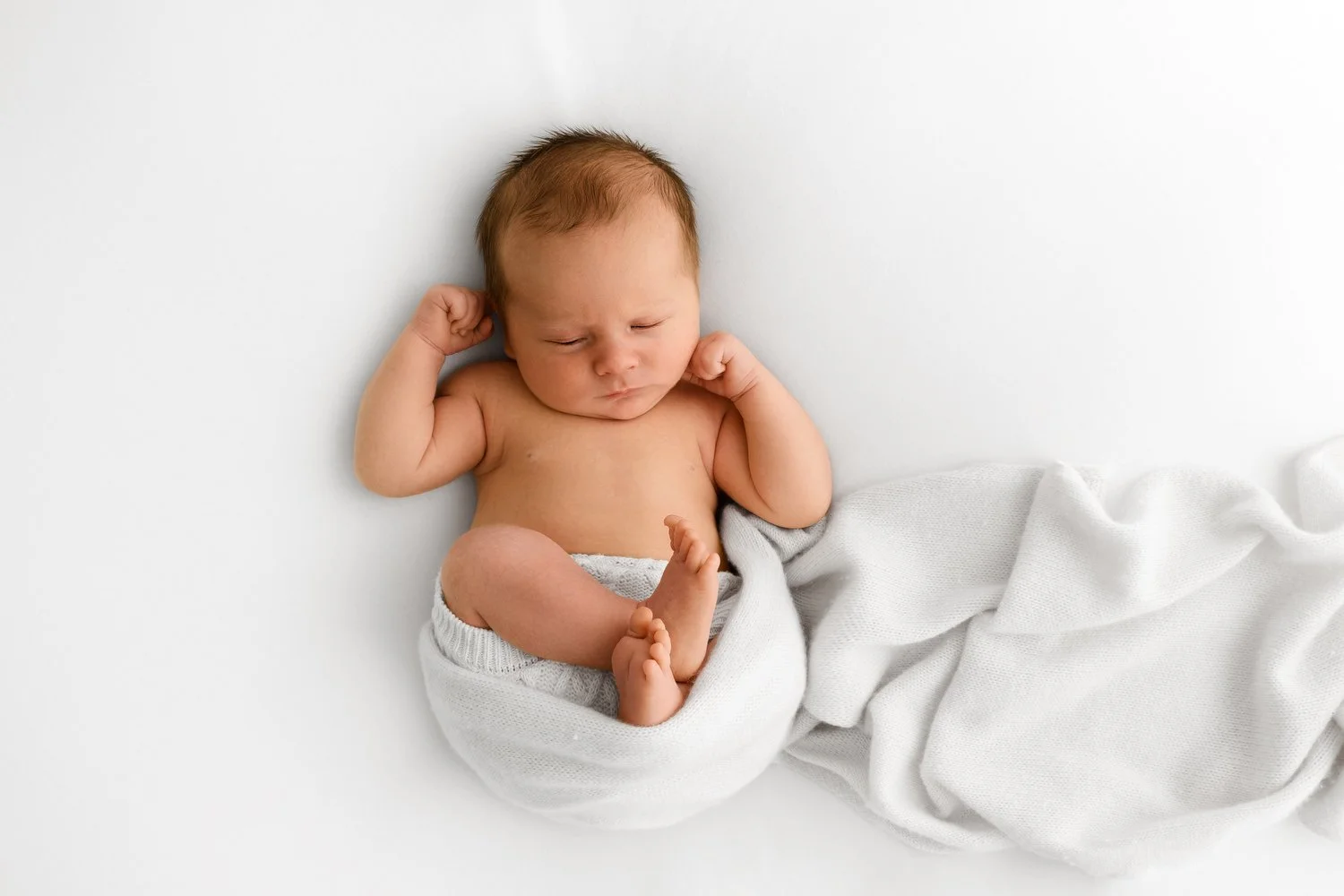wrapped newborn baby Newborn baby photographed at F6.4 with soft, dreamy background
