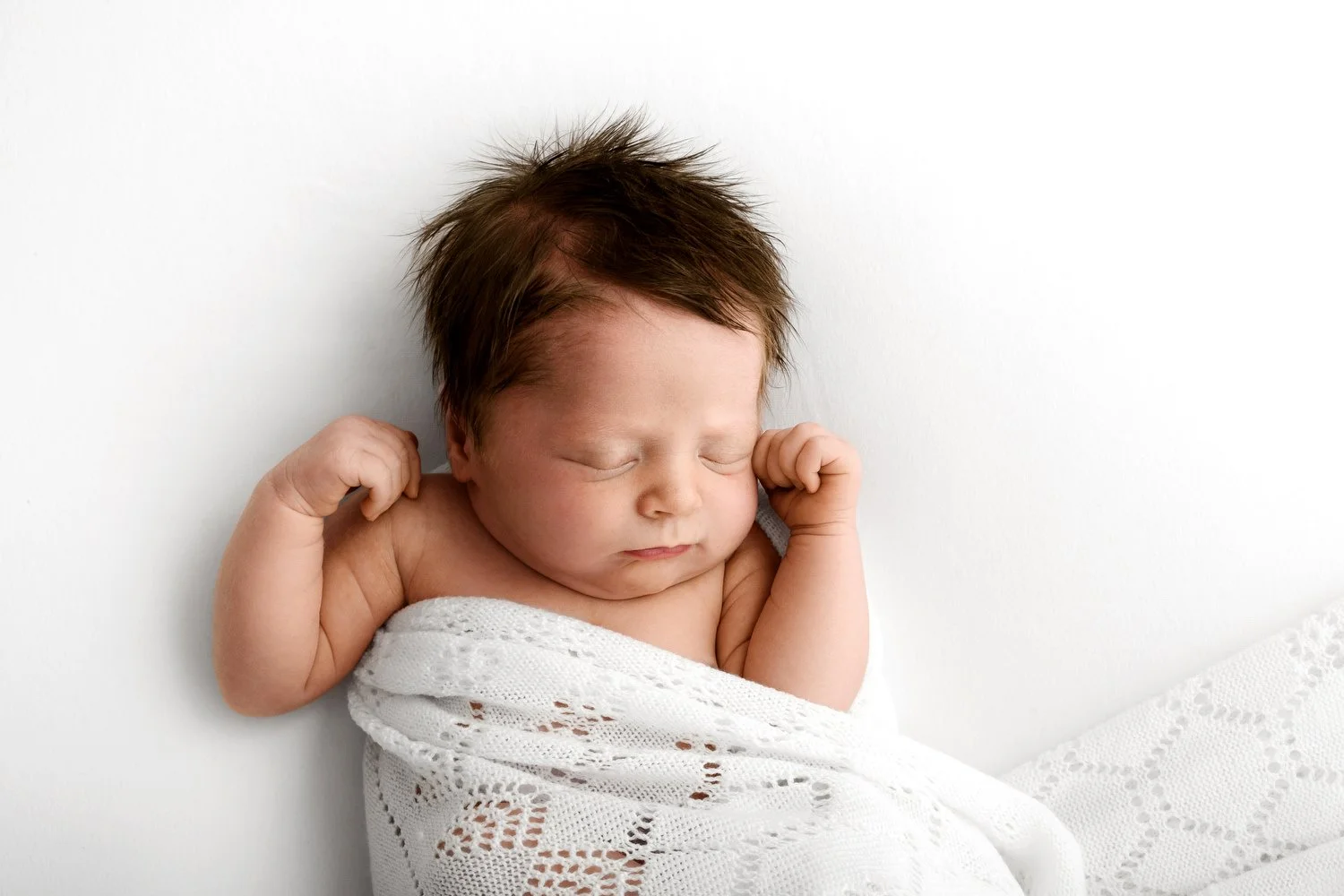 Sleeping newborn baby covered in white lace shawl — newborn photography education Scotland